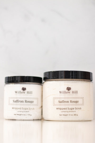 10 oz and 6 oz package of Saffron Rouge Whipped Sugar Scrub on a white background. 