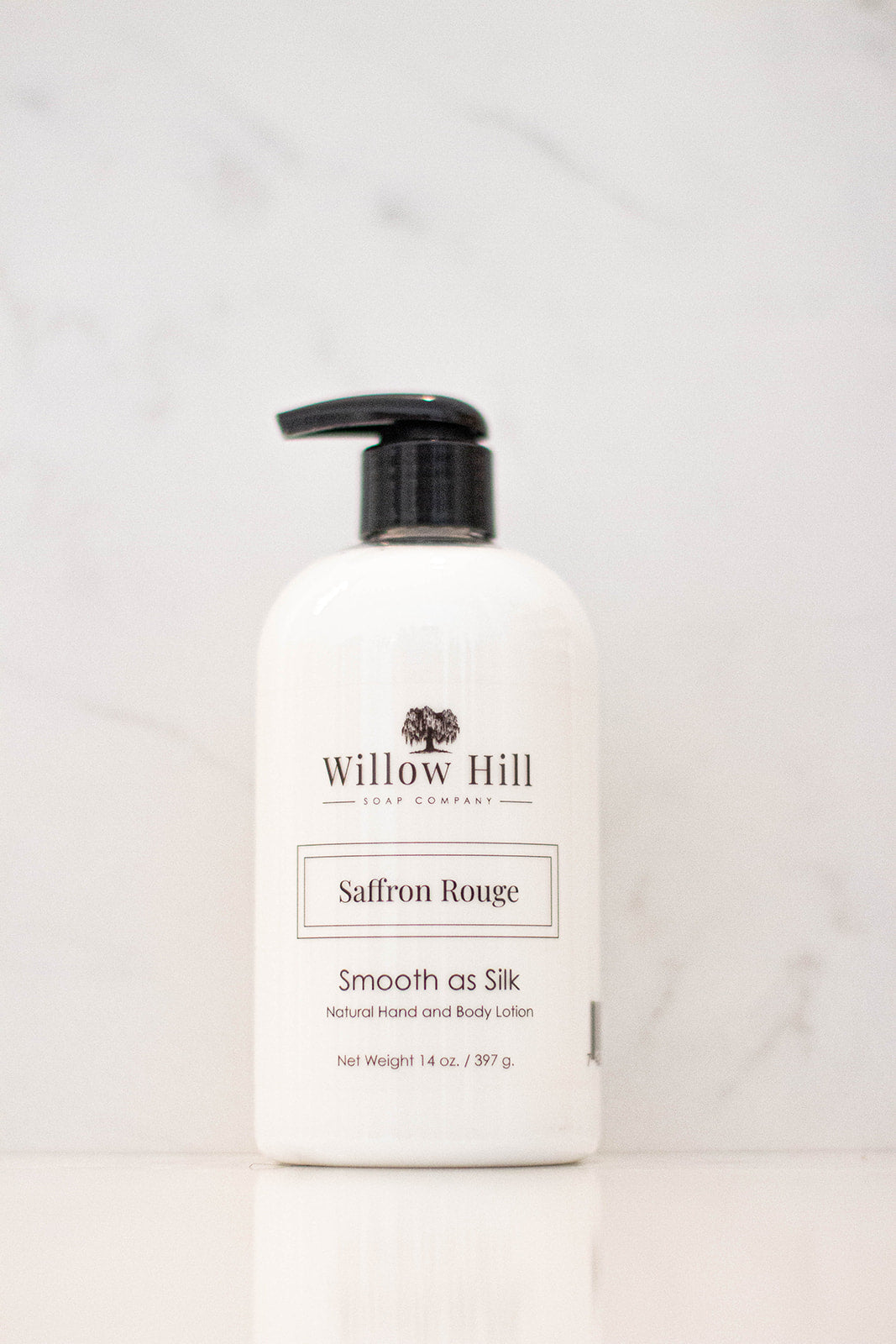 Saffron Rouge Smooth as Silk natural hand and body lotion in a plastic bottle. 